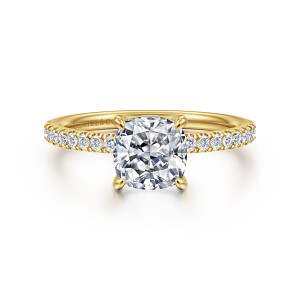Gabriel & Co. ER16570C6Y44JJ 14 karat yellow gold Contemporary engagement ring, front view of a cushion center held by four slim prongs above small stones on both shoulders
