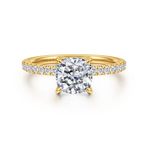 Gabriel & Co. ER16570C6Y84JJ 18 karat yellow gold Contemporary engagement ring, front view of a cushion cut center in four claw prongs above a slim band of small diamonds