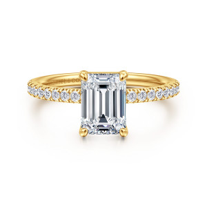 Gabriel & Co. ER16570E6Y84JJ 18 karat yellow gold Contemporary engagement ring, front view of an emerald cut center held by four corner prongs above a fine row of diamonds