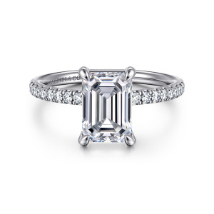 Gabriel & Co. ER16570E8W44JJ 14 karat white gold Contemporary engagement ring, front view of an emerald cut center between rounded claw tips above a pave band