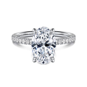 Gabriel & Co. ER16570O10W44JJ 14 karat white gold Contemporary engagement ring, front view of an oval center with rounded prongs and diamonds set along the band