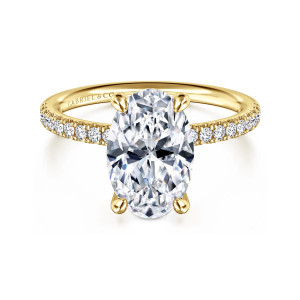 Gabriel & Co. ER16570O12Y44JJ 14 karat yellow gold Contemporary engagement ring, front view of an oval center in four rounded prongs above a band of small diamonds