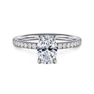 Gabriel & Co. ER16570O4W44JJ 14 karat white gold Contemporary engagement ring, front view of an oval center with four claw prongs and round diamonds along the band