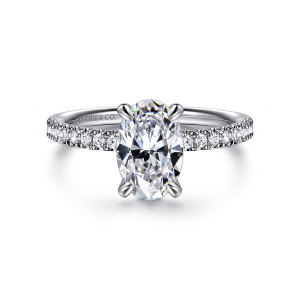 Gabriel & Co. ER16570O6W44JJ 14 karat white gold Contemporary engagement ring, front view of an oval center held by four claw prongs above the small diamond shoulders