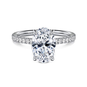 Gabriel & Co. ER16570O8W44JJ 14 karat white gold Contemporary engagement ring, front view of an oval center on four rounded claw prongs with diamonds along the shoulders