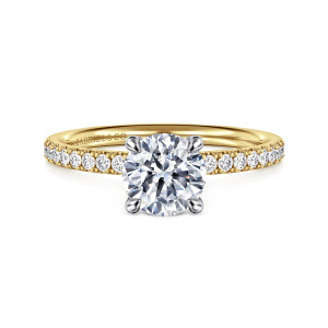 Gabriel & Co. ER16570R4M44JJ 14 karat white and yellow gold Contemporary engagement ring, front view of a round center in four rounded prongs with diamonds along both shoulders