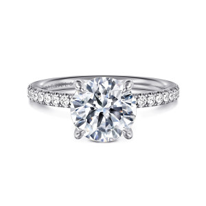 Gabriel & Co. ER16570R8W44JJ 14 karat white gold Contemporary engagement ring, front view of a round center held by four rounded claw tips with diamonds on both shoulders