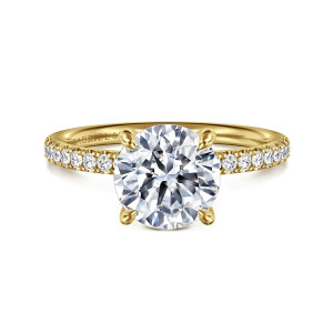 Gabriel & Co. ER16570R8Y44JJ 14 karat yellow gold Contemporary engagement ring, front view of a round center with rounded teardrop prong tips and small diamonds on either shoulder