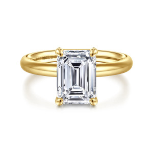 Gabriel & Co. ER16571E10Y4JJJ 14 karat yellow gold Contemporary engagement ring, front view of an emerald cut center in four corner claws over a smooth, plain band