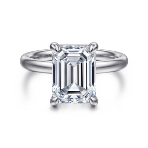 Gabriel & Co. ER16571E16W4JJJ 14 karat white gold Contemporary engagement ring, front view of an emerald cut center in four bulb tipped prongs over a smooth domed band