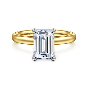 Gabriel & Co. ER16571E8M4JJJ 14 karat white and yellow gold Contemporary engagement ring, front view of an emerald cut center in four rounded claw prongs of the cooler tone