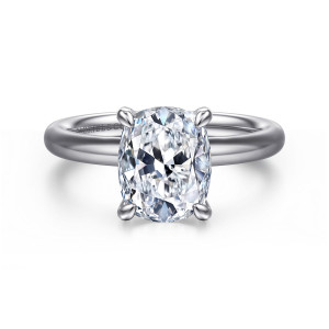 Gabriel & Co. ER16571G10W4JJJ 14 karat white gold Contemporary engagement ring, front view of an elongated cushion center in four claw prongs on a smooth unadorned band