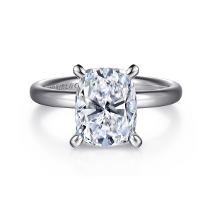 Gabriel & Co. ER16571G12W4JJJ 14 karat white gold Contemporary engagement ring, front view of four rounded prong tips around the center above a plain band