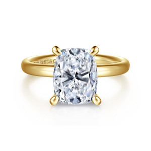 Gabriel & Co. ER16571G12Y4JJJ 14 karat yellow gold Contemporary engagement ring, front view of an elongated cushion center on four rounded prongs above a smooth polished band