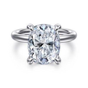 Gabriel & Co. ER16571G20W4JJJ 14 karat white gold Contemporary engagement ring, front view of an elongated cushion center held at its corners by bold prongs on a polished band