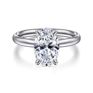 Gabriel & Co. ER16571O10W4JJJ 14 karat white gold Contemporary engagement ring, front view of an oval center gripped by four rounded prongs above a smooth band