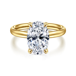 Gabriel & Co. ER16571O12Y4JJJ 14 karat yellow gold Contemporary engagement ring, front view of an oval center with two claws at each end above a plain rounded band