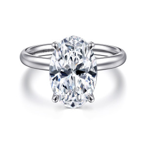 Gabriel & Co. ER16571O16W4JJJ 14 karat white gold Contemporary engagement ring, front view of an oval center between four rounded claws over a smooth polished band
