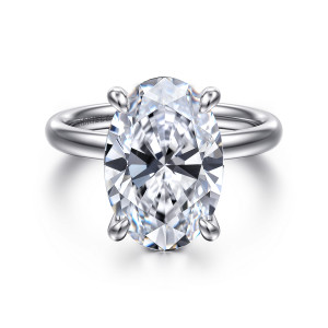 Gabriel & Co. ER16571O20W4JJJ 14 karat white gold Contemporary engagement ring, front view of a large oval center between four rounded prongs on a polished smooth hoop
