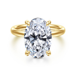 Gabriel & Co. ER16571O20Y4JJJ 14 karat yellow gold Contemporary engagement ring, front view of a large oval center in bulb tipped prongs above a plain rounded band