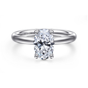 Gabriel & Co. ER16571O6W4JJJ 14 karat white gold Contemporary engagement ring, front view of an oval center in four small ball tipped prongs on a plain polished band