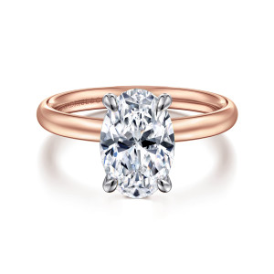 Gabriel & Co. ER16571O8T4JJJ 14 karat white and rose gold Contemporary engagement ring, front view of an oval center in four slim claws, the cool head against a warm smooth band