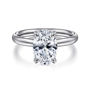 Gabriel & Co. ER16571O8W4JJJ 14 karat white gold Contemporary engagement ring, front view of an oval center held by four teardrop tipped prongs over a smooth domed band