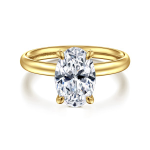 Gabriel & Co. ER16571O8Y4JJJ 14 karat yellow gold Contemporary engagement ring, front view of an oval center with four rounded claw prongs over a smooth domed band