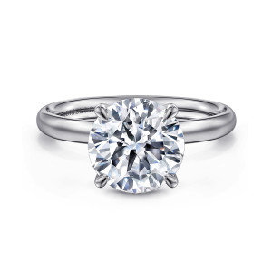 Gabriel & Co. ER16571R12W4JJJ 14 karat white gold Contemporary engagement ring, front view of a round center gripped by four rounded claws over a polished band