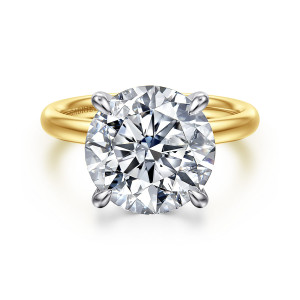 Gabriel & Co. ER16571R20M4JJJ 14 karat white and yellow gold Contemporary engagement ring, front view of a round center in teardrop tipped prongs against a smooth warmer toned band