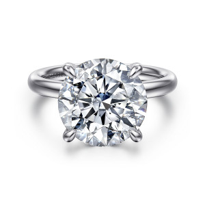 Gabriel & Co. ER16571R20W4JJJ 14 karat white gold Contemporary engagement ring, front view of a large round center with rounded prong tips against a plain domed band