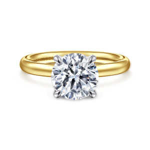 Gabriel & Co. ER16571R8M4JJJ 14 karat white and yellow gold Contemporary engagement ring, front view of a round center held by four cooler toned claw prongs above a domed band