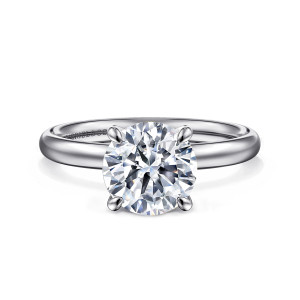 Gabriel & Co. ER16571R8PTJJJ platinum Contemporary engagement ring, front view of a round center between four slim claws on a smooth band with no stones