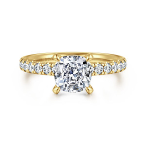 Gabriel & Co. ER16572C6Y44JJ 14 karat yellow gold Contemporary engagement ring, front view of a cushion cut center with four rounded claw prongs and diamonds on both shoulders