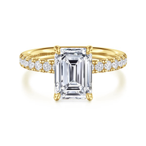 Gabriel & Co. ER16572E10Y44JJ 14 karat yellow gold Contemporary engagement ring, front view of the emerald cut center gripped at its corners by four claw prongs