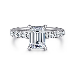 Gabriel & Co. ER16572E6PT4JJ platinum Contemporary engagement ring, front view of the emerald cut center held at its corners by rounded prongs above shoulder diamonds