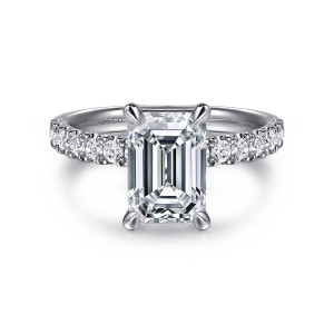 Gabriel & Co. ER16572E8W44JJ 14 karat white gold Contemporary engagement ring, front view of an emerald cut center with corner claws and a shoulder row of round diamonds