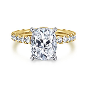 Gabriel & Co. ER16572G12M44JJ 14 karat white and yellow gold Contemporary engagement ring, front view of an elongated cushion center in four claw prongs with round stones on each shoulder