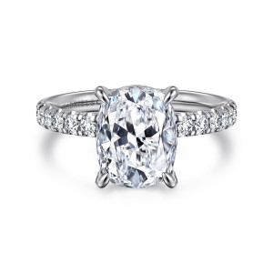 Gabriel & Co. ER16572G12W44JJ 14 karat white gold Contemporary engagement ring, front view of an elongated cushion center with four rounded prongs and diamonds on each shoulder