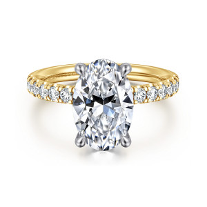 Gabriel & Co. ER16572O12M44JJ 14 karat white and yellow gold Contemporary engagement ring, front view of the oval center with four claw prongs in the cooler tone against a warmer band