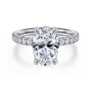Gabriel & Co. ER16572O12W44JJ 14 karat white gold Contemporary engagement ring, front view of a long oval center with two claws at each end and diamond shoulders