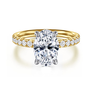 Gabriel & Co. ER16572O8M44JJ 14 karat white and yellow gold Contemporary engagement ring, front view of an oval center gripped by four slim prongs, round stones curving away on each side