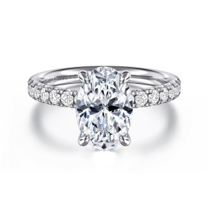 Gabriel & Co. ER16572O8W44JJ 14 karat white gold Contemporary engagement ring, front view of a tall oval center with four claws and small diamonds along the shoulders