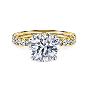 Gabriel & Co. ER16572R10M44JJ 14 karat white and yellow gold Contemporary engagement ring, front view of a round center held by rounded tip prongs, with diamonds on the warmer toned band