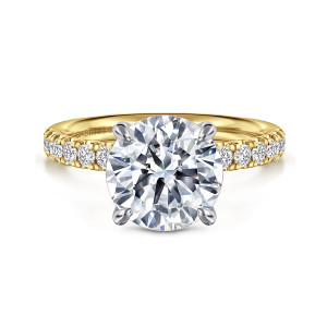 Gabriel & Co. ER16572R12M44JJ 14 karat white and yellow gold Contemporary engagement ring, front view of a round center held by four rounded prongs, with the cooler toned head against the warm band
