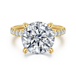 Gabriel & Co. ER16572R20Y44JJ 14 karat yellow gold Contemporary engagement ring, front view of a round center with four teardrop tipped claw prongs and diamonds on the shoulders