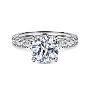 Gabriel & Co. ER16572R8W44JJ 14 karat white gold Contemporary engagement ring, front view of a round center in four rounded prongs with diamonds along both shoulders