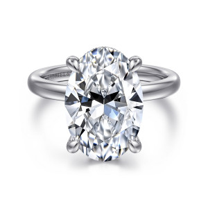 Gabriel & Co. ER16618O20W44JJ 14 karat white gold Classic engagement ring, front view of an oval center held by four prongs with teardrop tips and a fine beaded edge