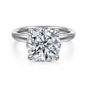 Gabriel & Co. ER16618R16W44JJ 14 karat white gold Classic engagement ring, front view of a round center held by four rounded prongs on a smooth band