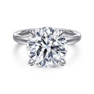 Gabriel & Co. ER16618R20W44JJ 14 karat white gold Classic engagement ring, front view of a round center in four prongs with no stones visible around it